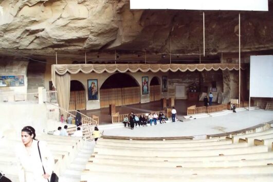 Rock-cut church inside Mokattam Mountain in Cairo, Egypt – interior of Saint Simon Monastery carved into the mountain