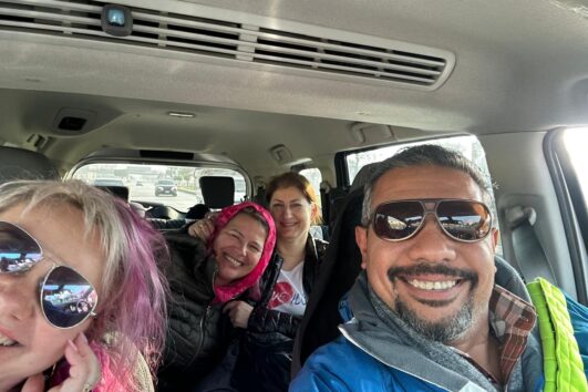 Selfie inside a private tour vehicle during a fun city tour in Cairo, Egypt, capturing the excitement of exploring the city